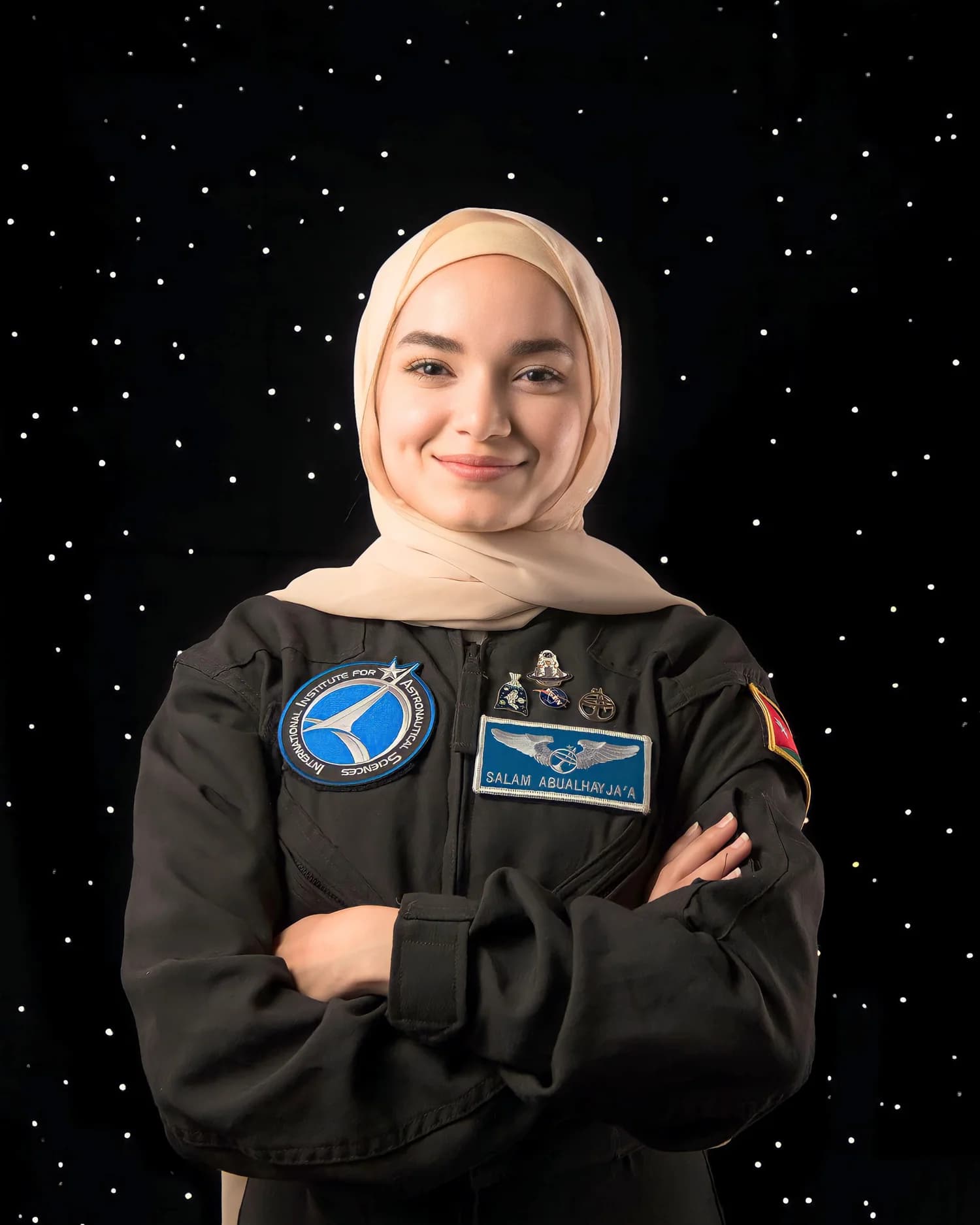 Eng. Salam Abualhayjaa wearing a black analog astronaut suit